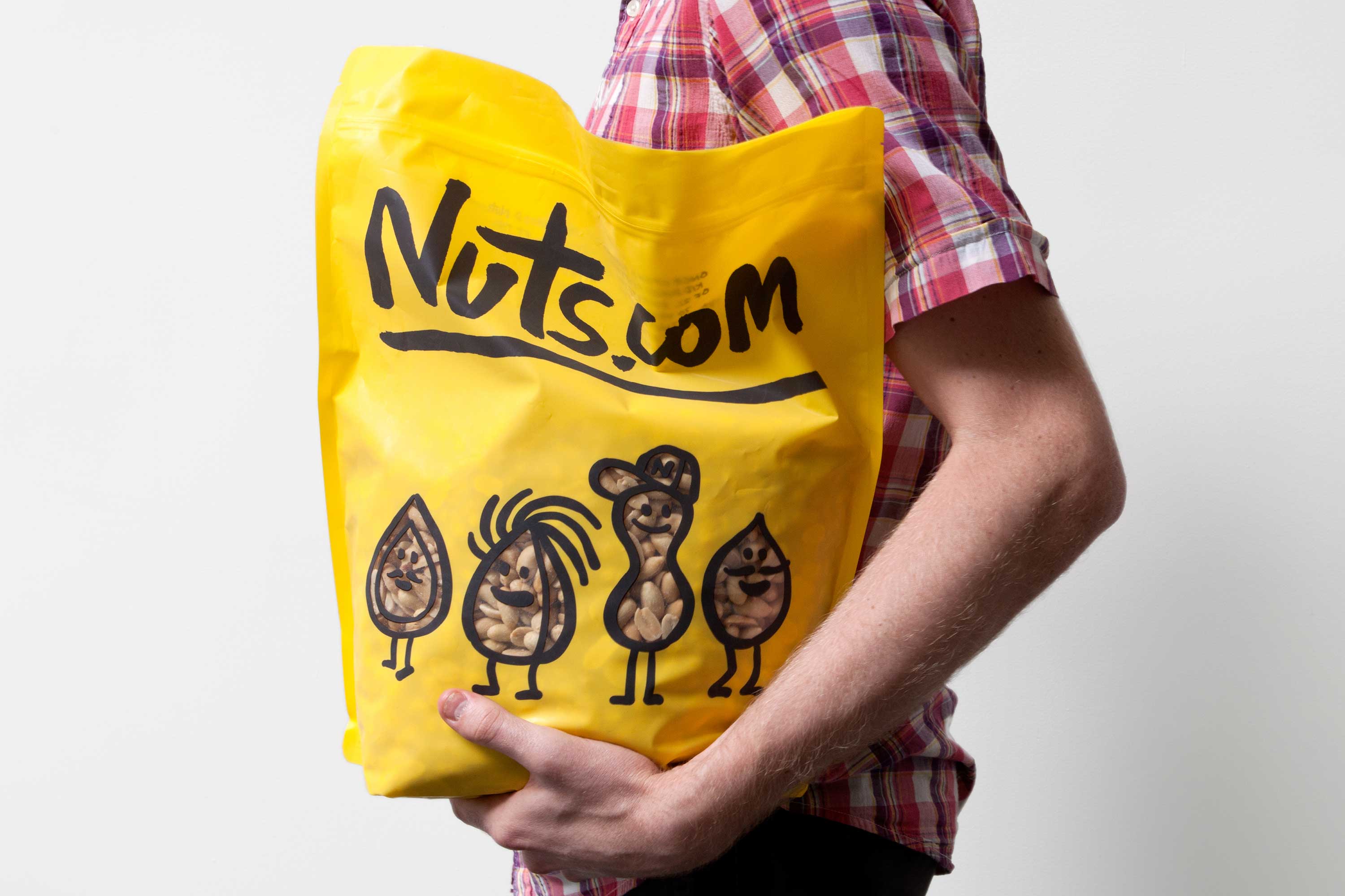 New packaging with illustrated character detail designed by Pentagram for nut, snack, tea and coffee brand Nuts.com