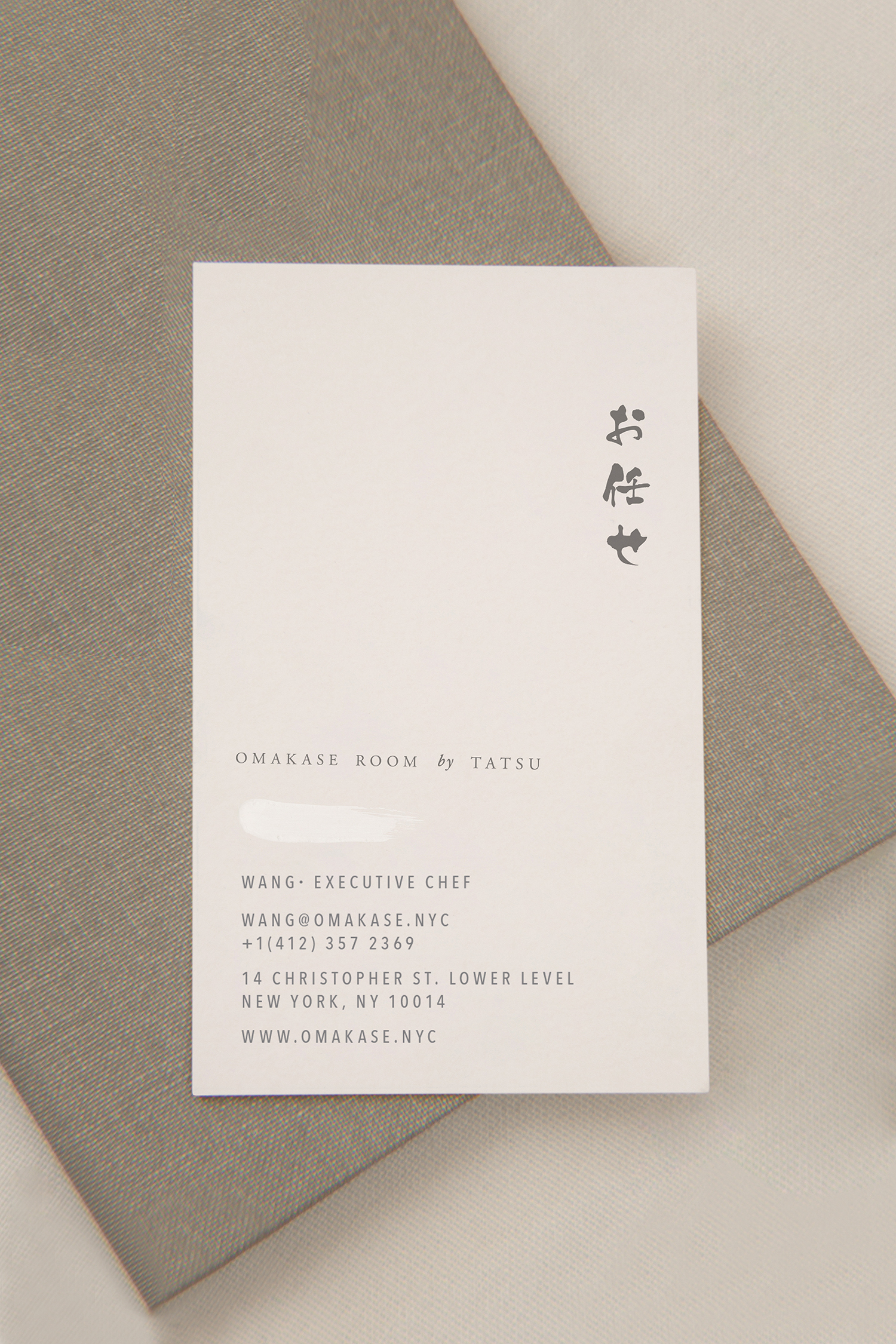 Visual identity and business card designed by Savvy for New York restaurant Omakase Room by Tatsu