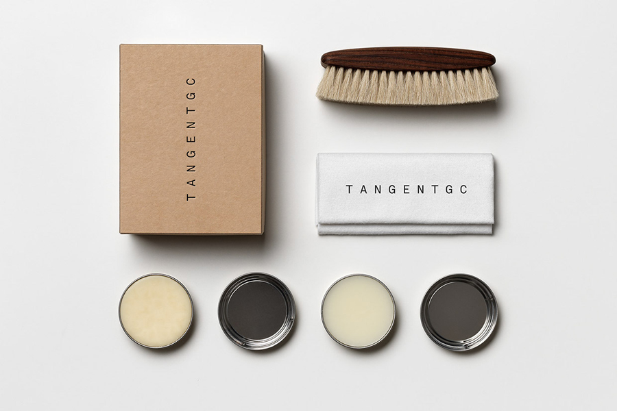 Logo and packaging for Swedish organic garment and shoe care brand Tangent Garment Care designed by Essen