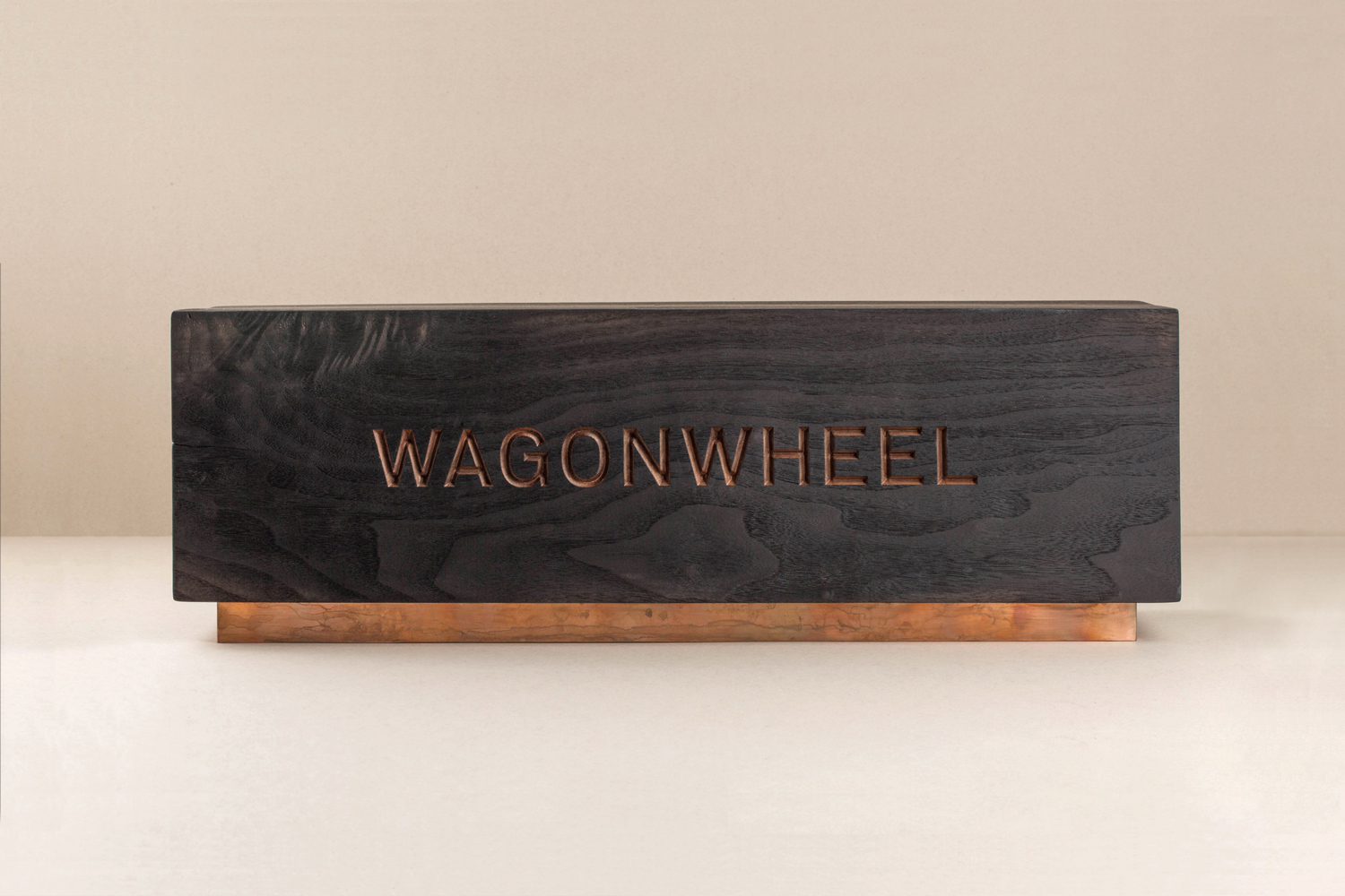 Brand identity and wood signage for Nashville-based boutique real estate title and escrow company Wagon Wheel designed by Perky Bros.