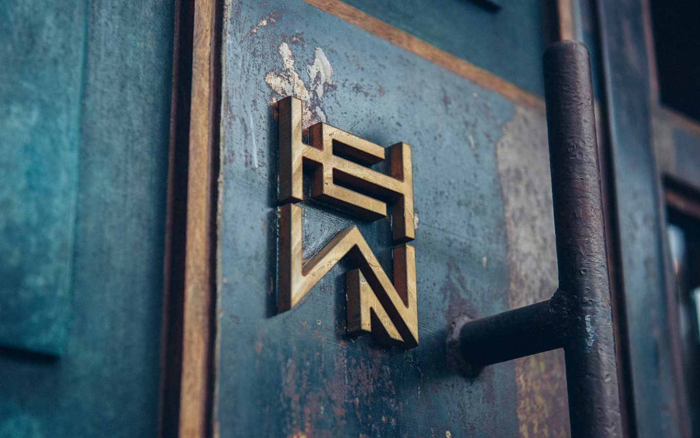 Logo and signage for woodworking shop Hewn designed by Föda, United States