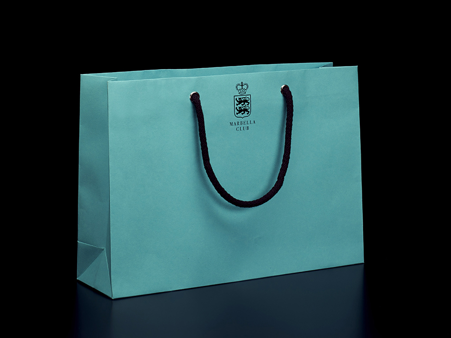 Logo and shopping bag designed by Pentagram for Spanish hotel, golf club and spa resort Marbella Club