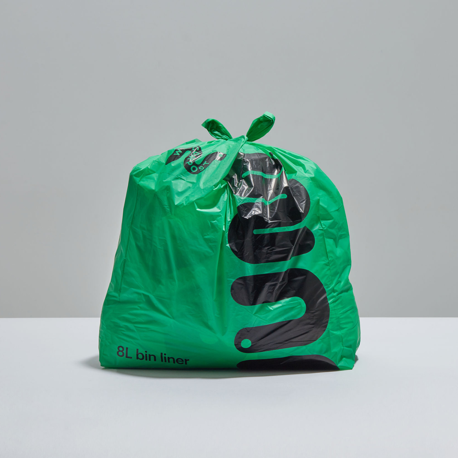 Logo and compostable bin liners designed by Seachange for leading commercial compostable waste collection service We Compost