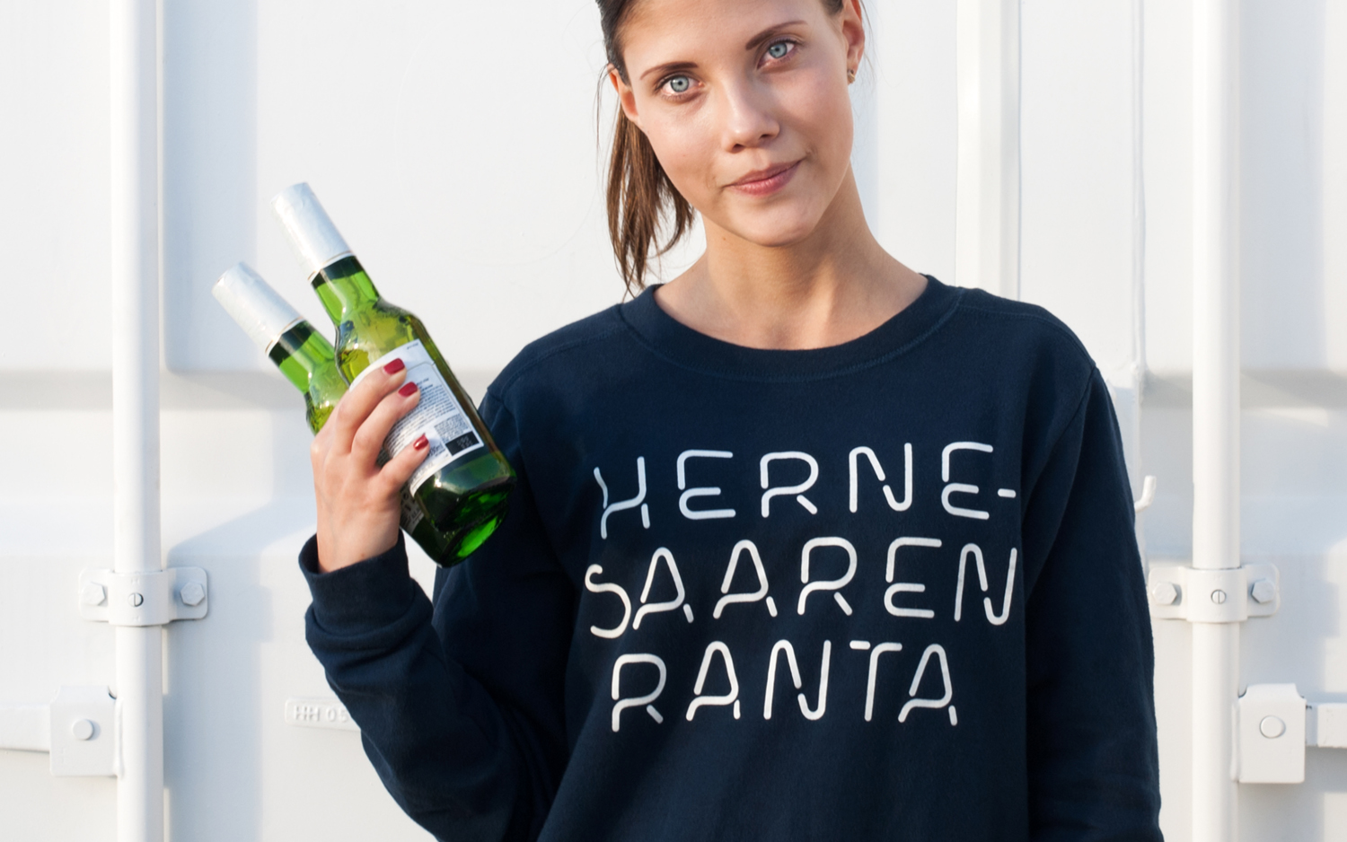 Brand identity and branded sweatshirt for Hernesaaren Ranta by Werklig, Finland