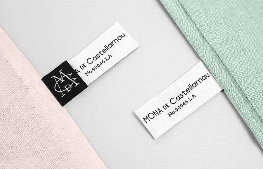 Monogram, logotype and embroidered labels for luxury lifestyle brand Mona De Castellarnau designed by Anagrama