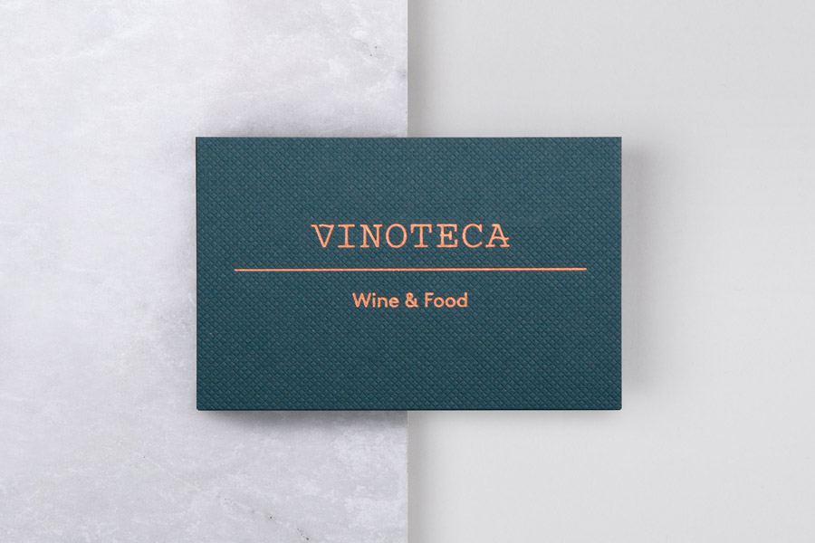Business card with copper block foil print finish for London restaurant group Vinoteca by British graphic design studio dn&co.