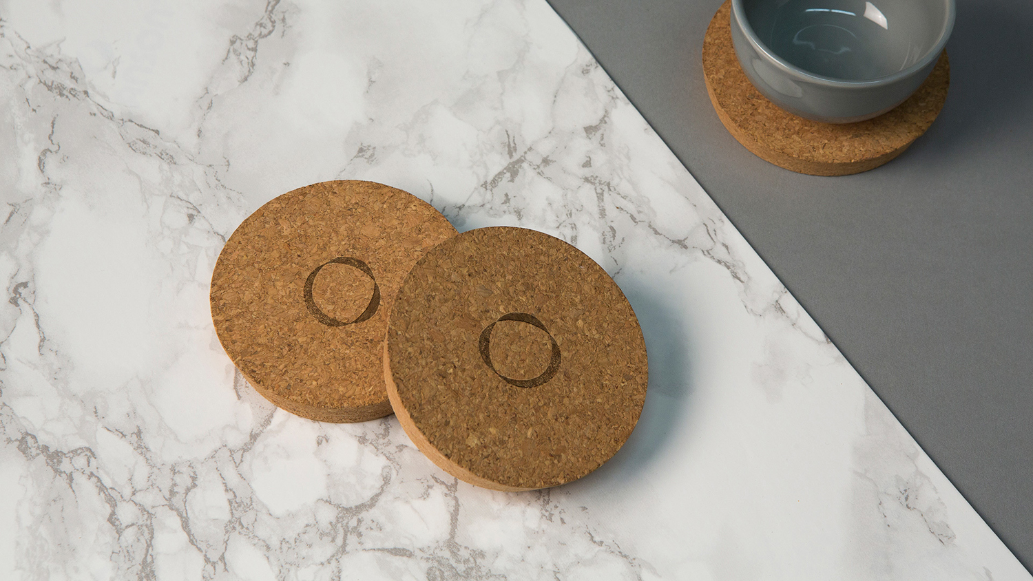 Logo and stamped cork coasters designed by Sagmeister & Walsh for contemporary restaurant Otium
