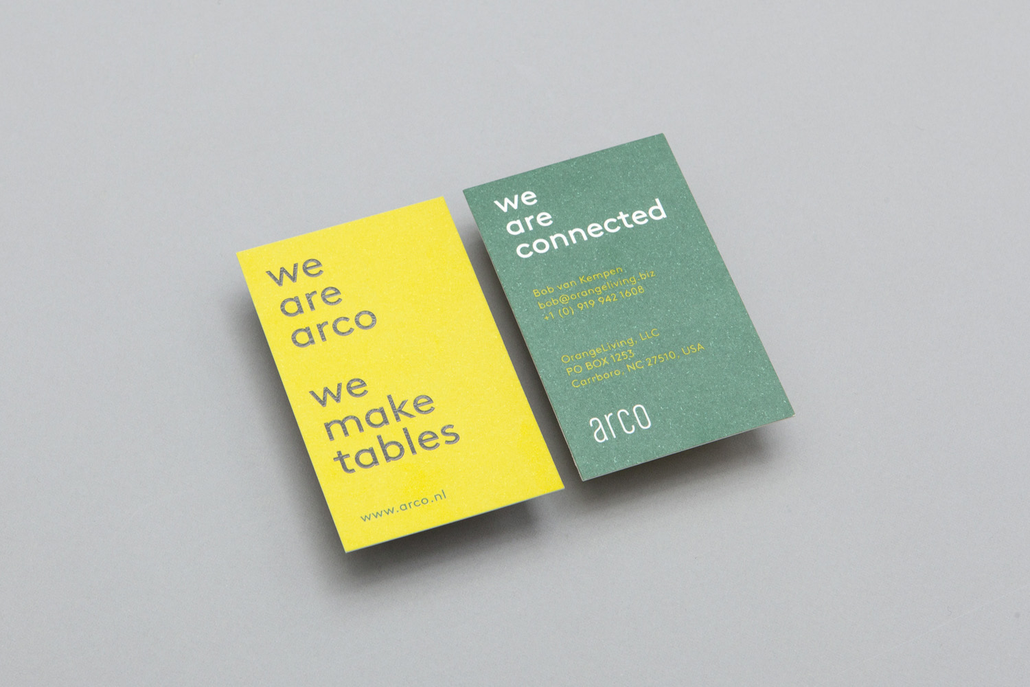Business cards for Dutch contemporary furniture business Arco designed by Arco. These feature the font Brown, a green and yellow colour palette and a black thermographic print finish.
