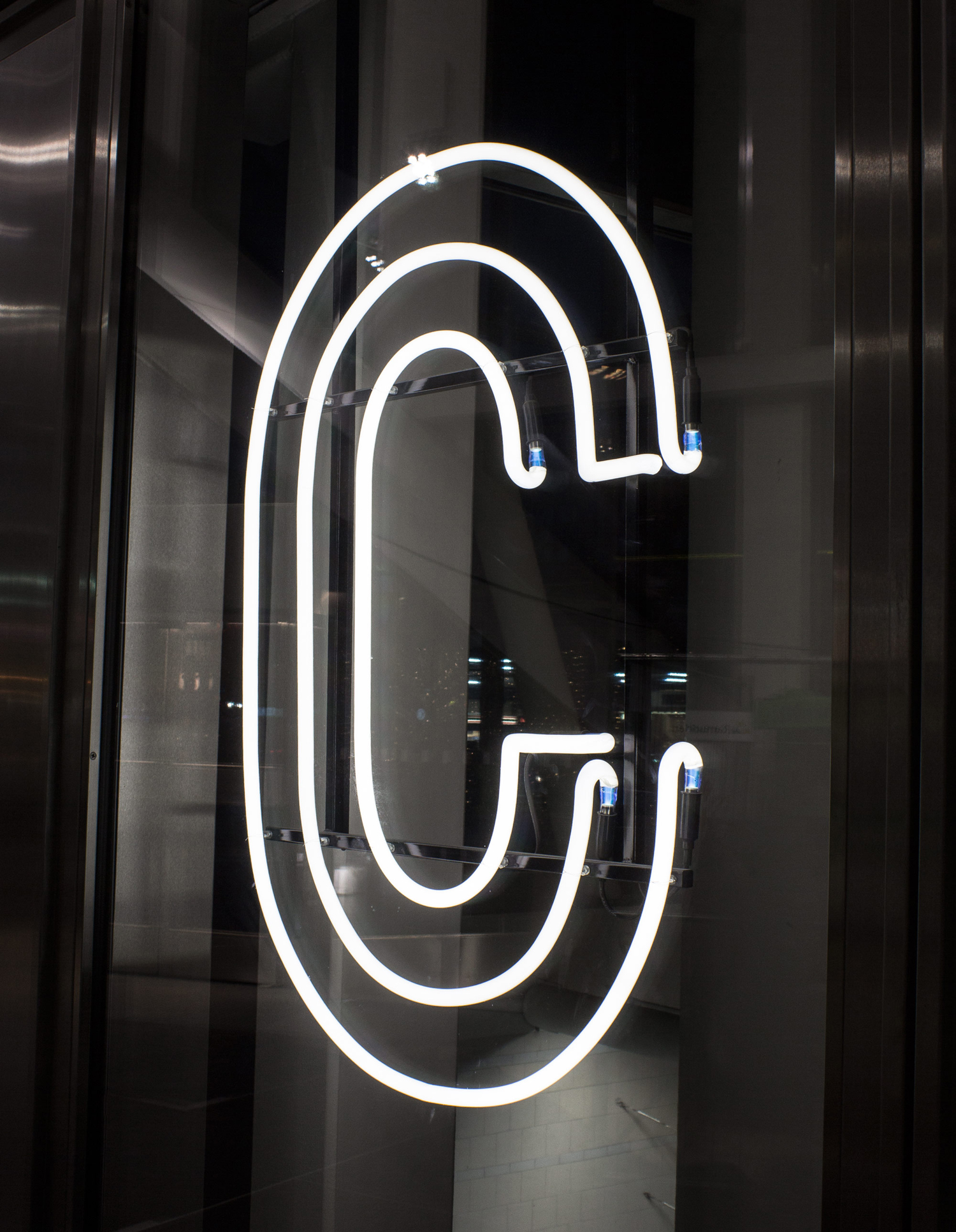 Logo and neon signage designed by 25ah for Stockholm cafe Caldo Coffee at the Scandic Continental