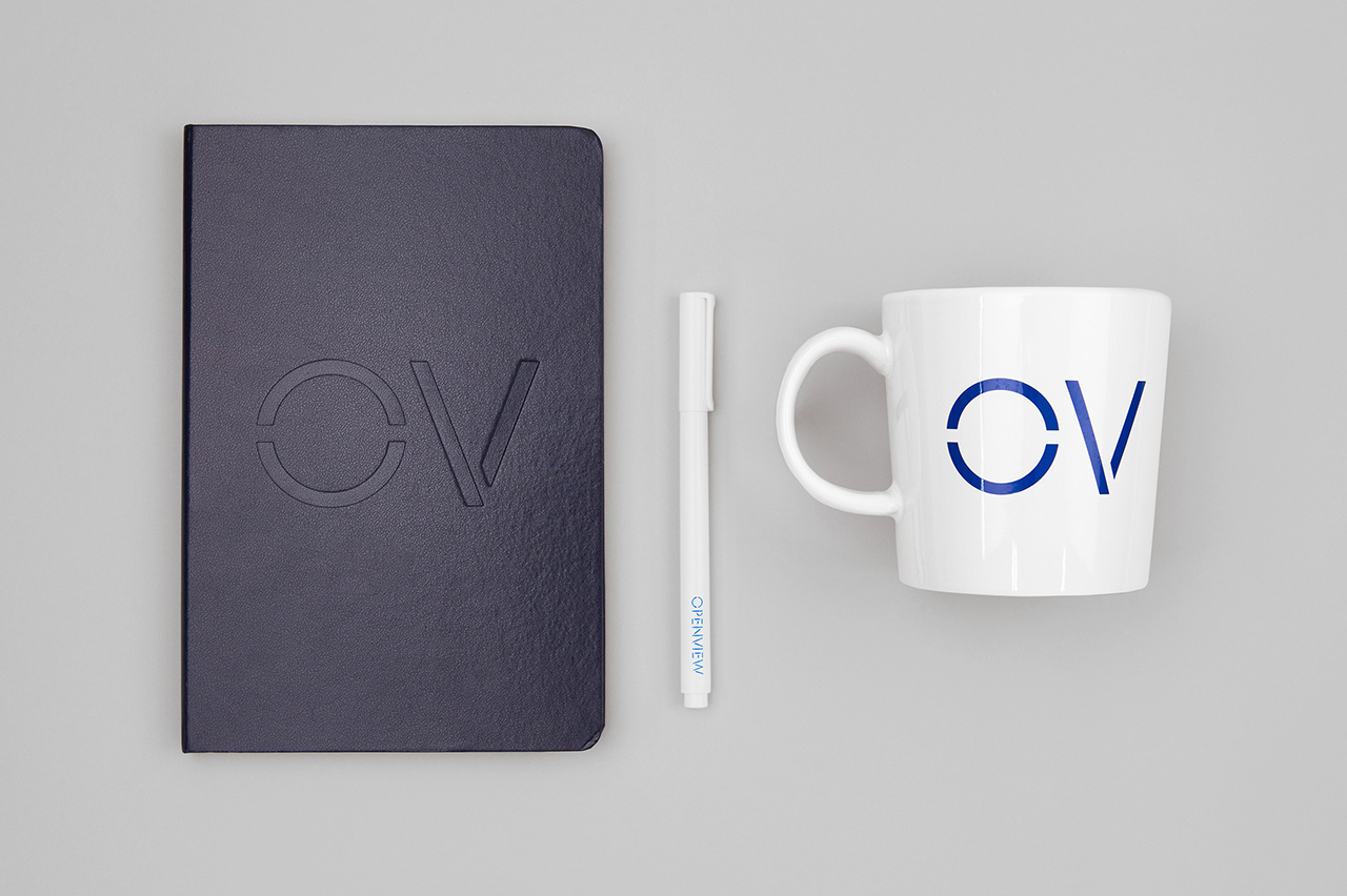 Brand identity and branded notebook and mug by Pentagram for Boston-based venture capital firm OpenView.