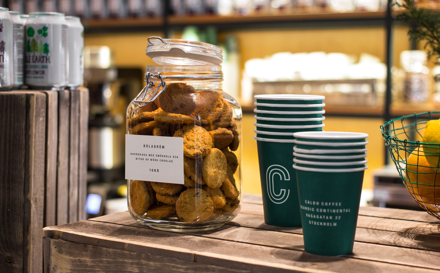 Branded coffee cups and price tags designed by 25ah for Stockholm cafe Caldo Coffee at the Scandic Continental