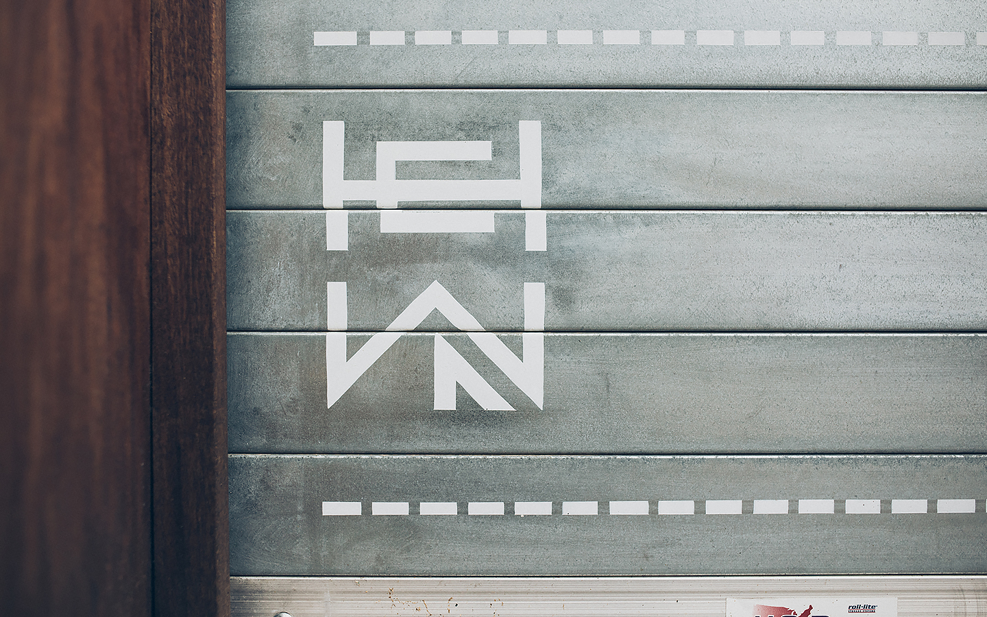 Logo and signage for woodworking shop Hewn designed by Föda, United States