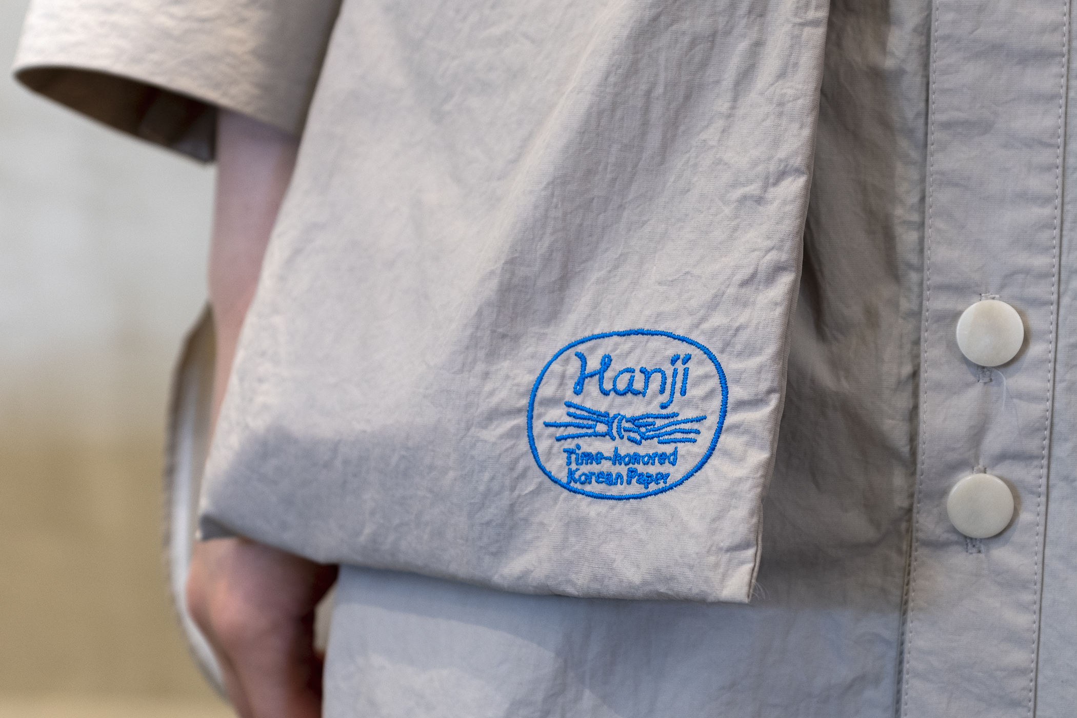 Logo and embroidered uniform by Studio fnt for Korean paper brand Hanji