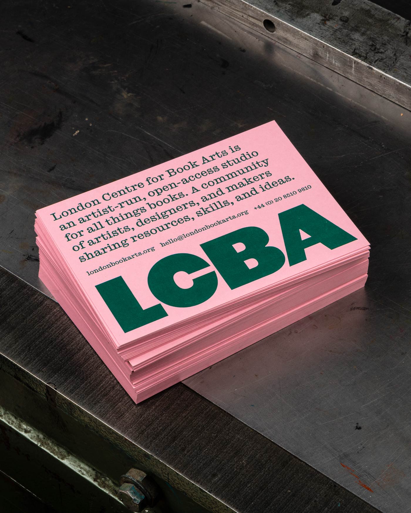 Pink and green typographic postcard design for the London Centre for Book Arts designed by Studio Bergini