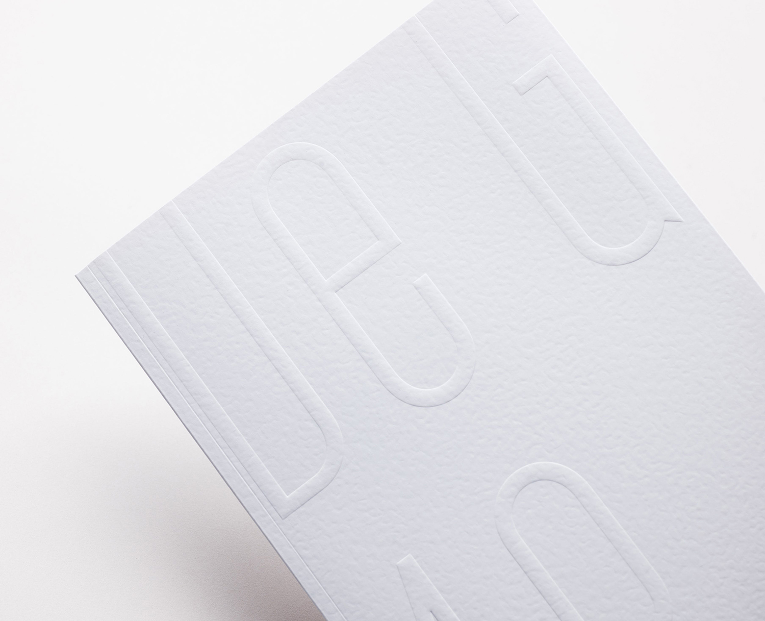Blind embossed print by Base Design for high-end jewellery brand, expert watchmaker and retailer Maison De Greef 1848