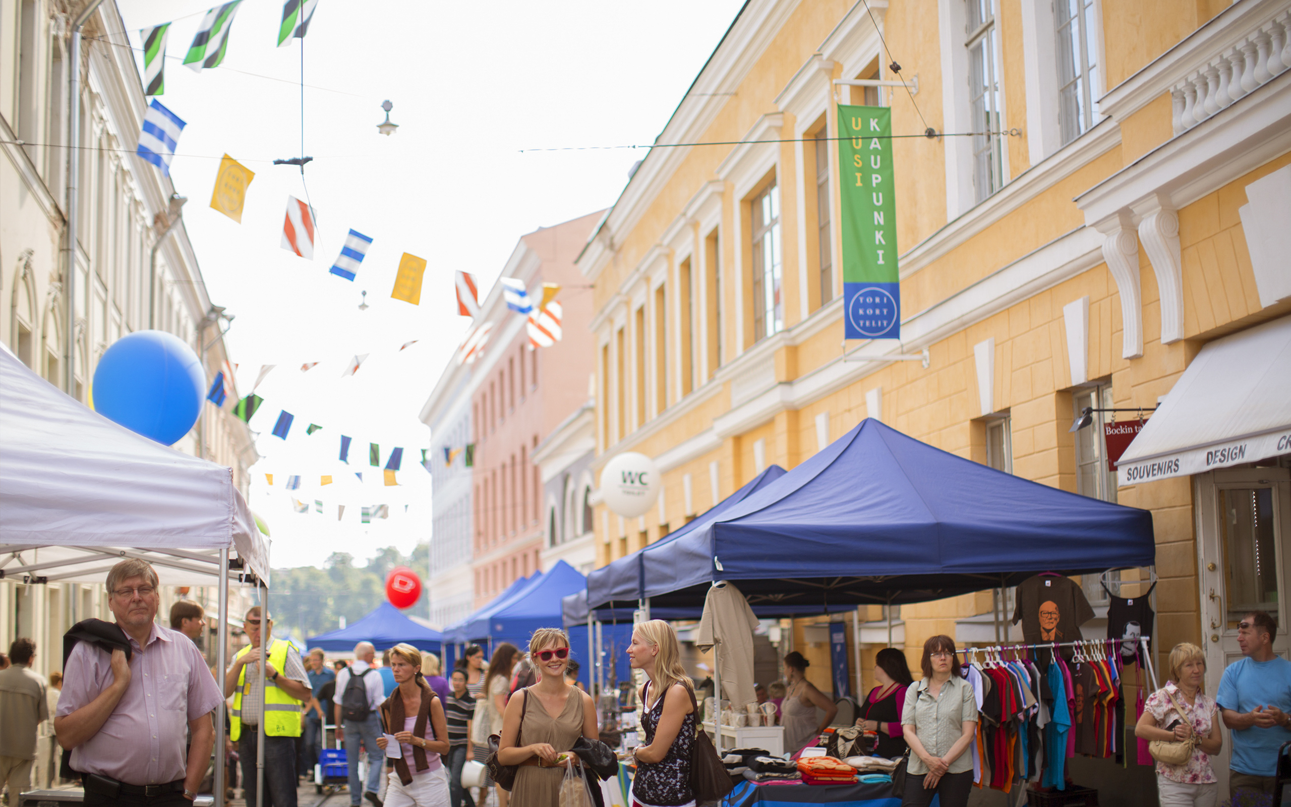 Logo and signage for Torikorttelit, the old town district of Helsinki, designed by KokoroMoi