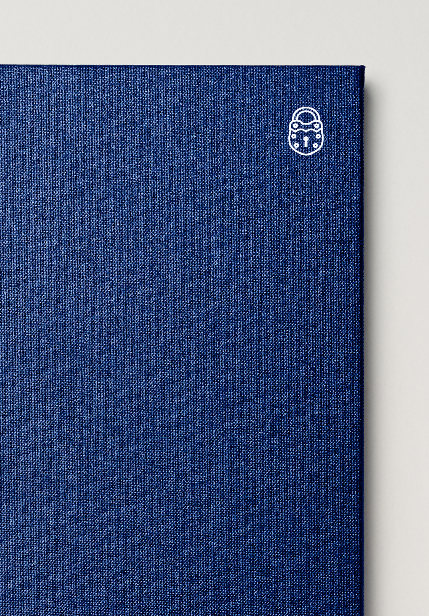 Brand identity and menu with blue fabric cover and white block foil designed by Swear Words for Melbourne-based French bistro Chez Olivier.