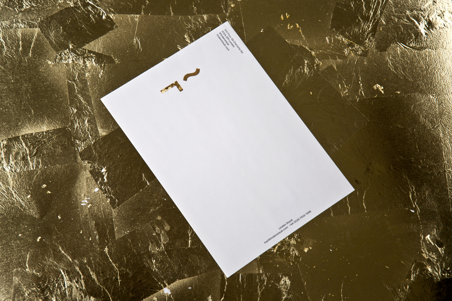 Logo and gold foiled envelope and headed paper for UK model agency Linden Staub by London-based graphic design studio Bibliothèque.