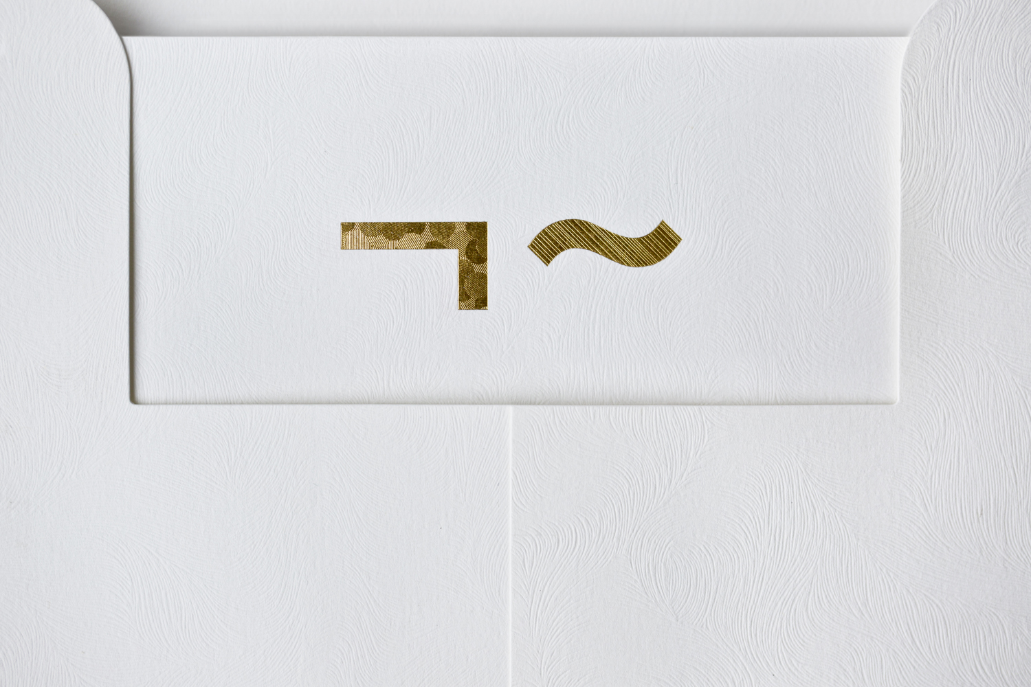 Logo and gold foiled envelope and headed paper for UK model agency Linden Staub by London-based graphic design studio Bibliothèque.
