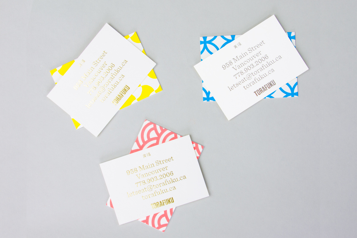 Gold foiled business cards for contemporary pan Asian restaurant Torafuku by graphic design studio Brief