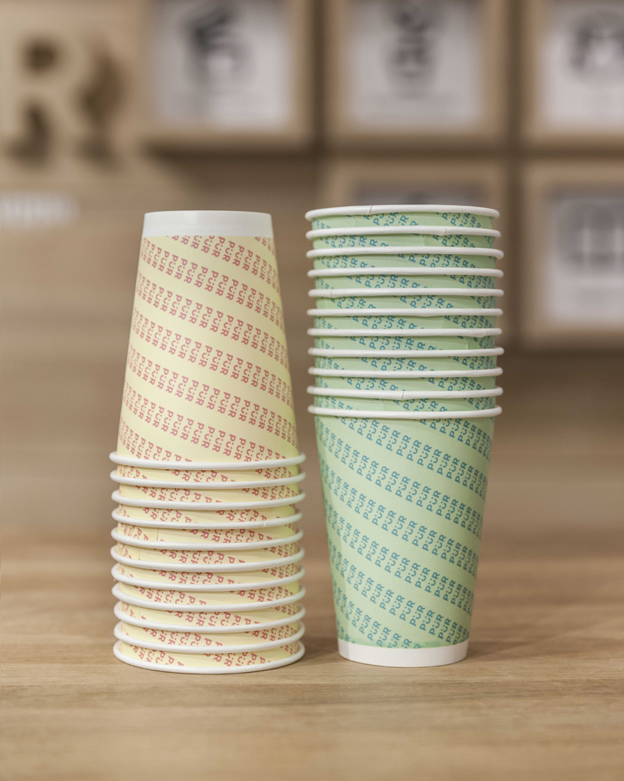 Branded cups designed by Bond for Helsinki-based health store PÜR