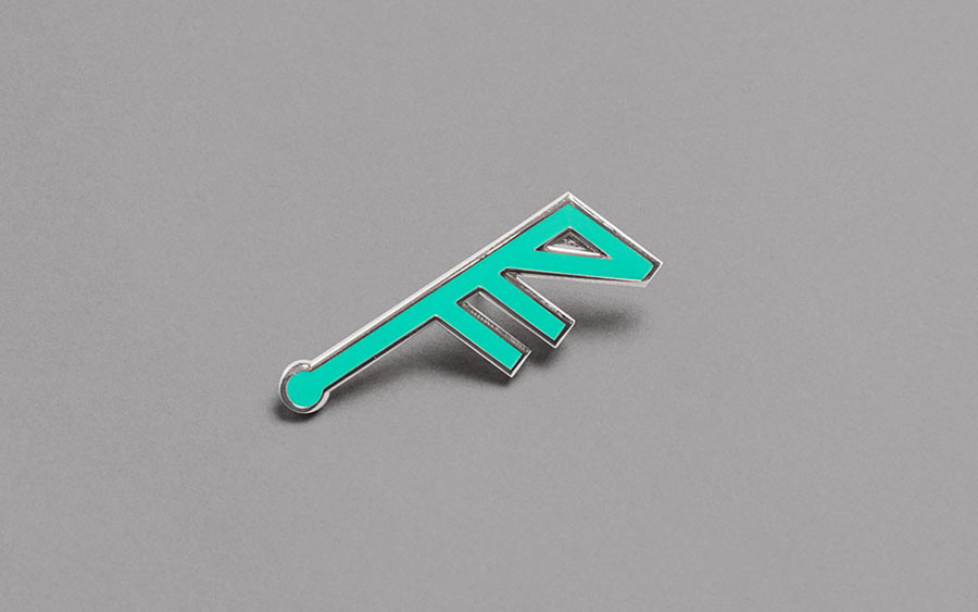 Logo as pin badge for concert hall Fosnavaag Cultural Centre designed by Heydays
