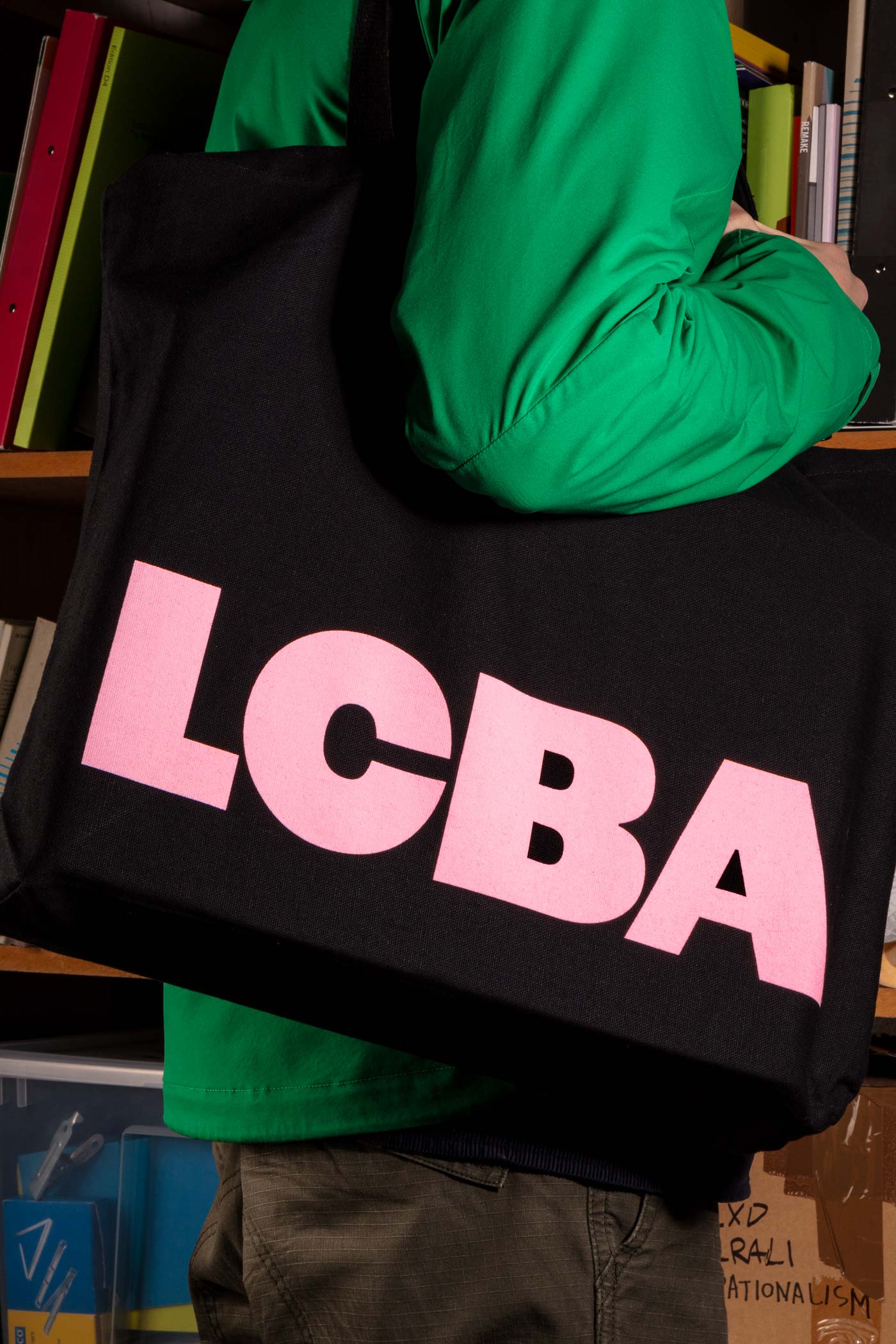Black tote bag screen printed with pink for the London Centre for Book Arts designed by Studio Bergini