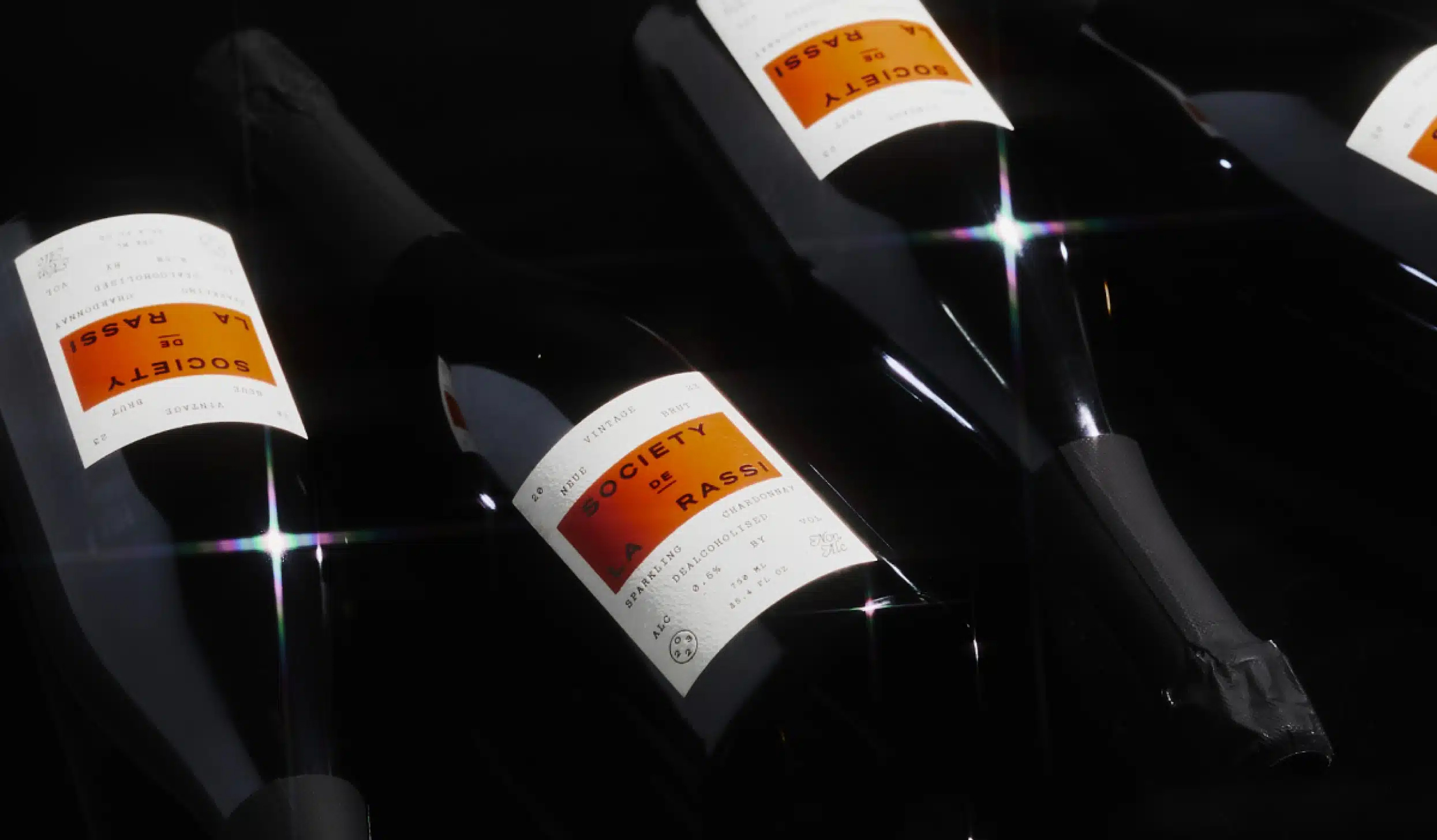 Logotype, art direction and packaging for alcohol-free champaign brand Society De La Rassi designed by Blurr Bureau