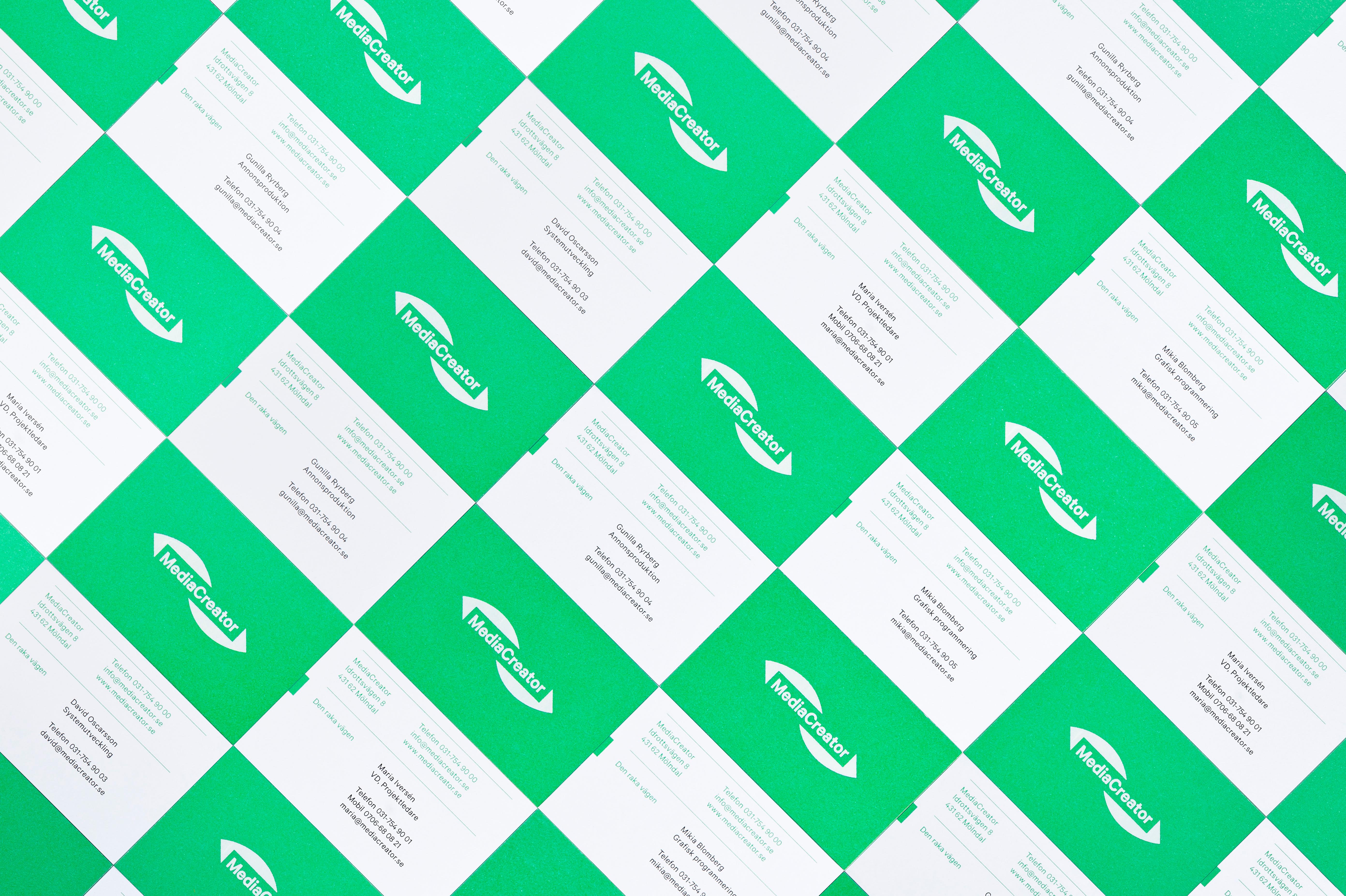 Logo and business card with fluorescent green paper and white ink combination designed by Lundgren+Lindqvist for Swedish print production and project management company MediaCreator