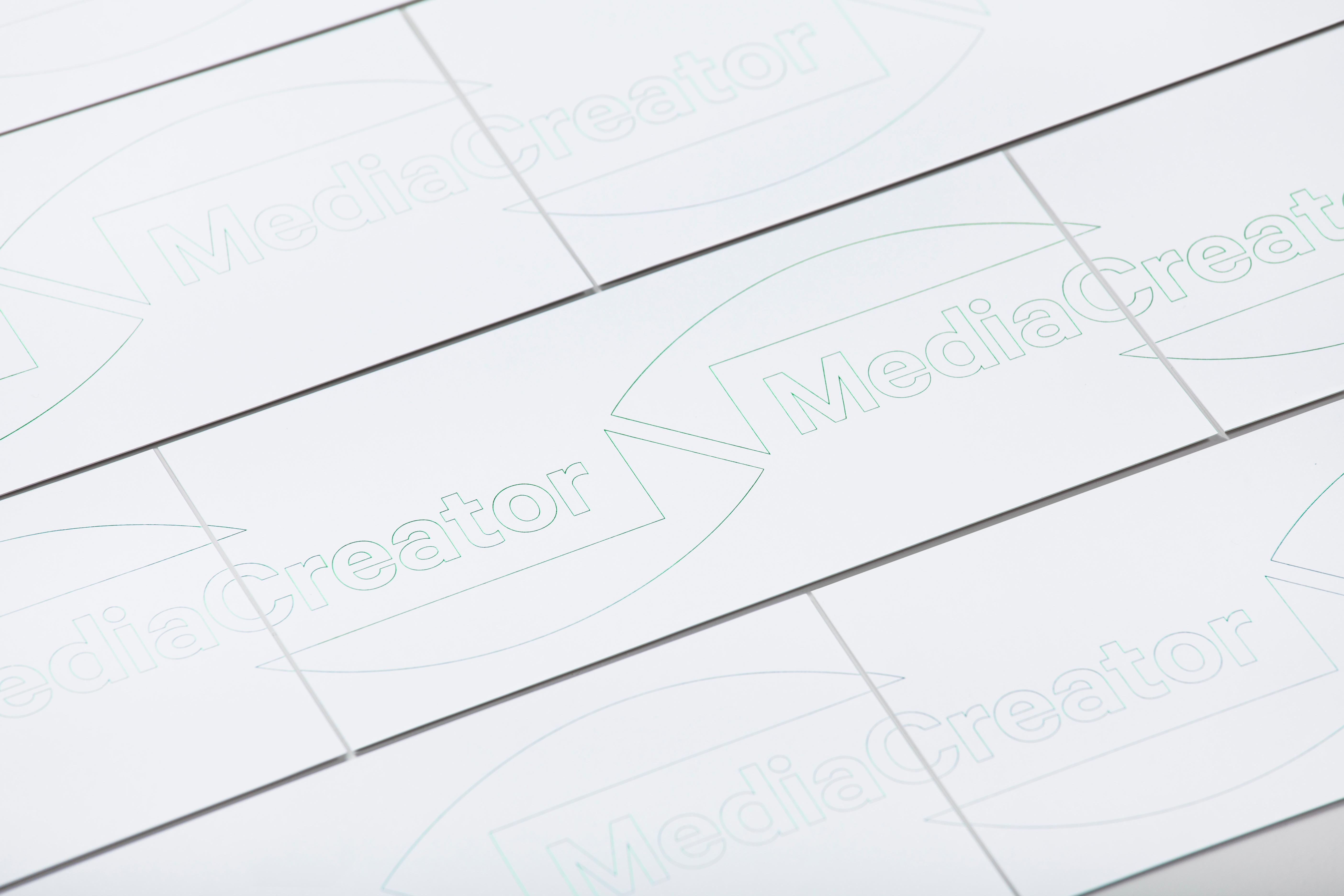 Logo and correspondence cards with green fluorescent ink detail designed by Lundgren+Lindqvist for Swedish print production and project management company MediaCreator