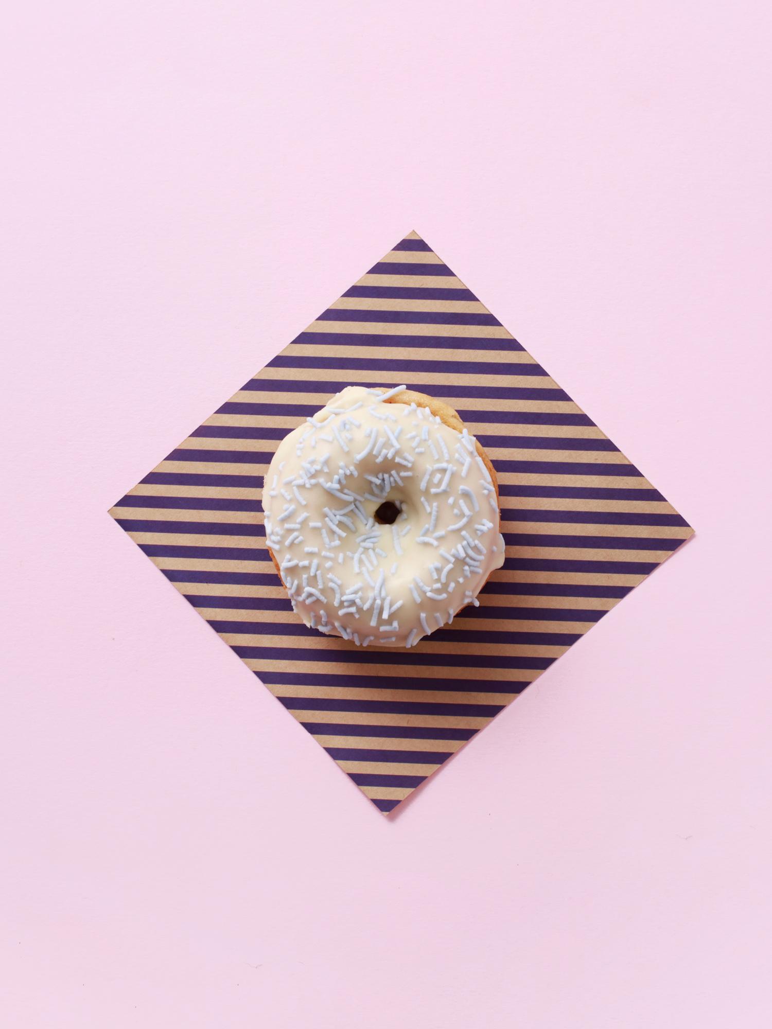 Brand identity, napkins and art direction by Sydney-based graphic design studio Garbett for donut bakery Happy Maple. 