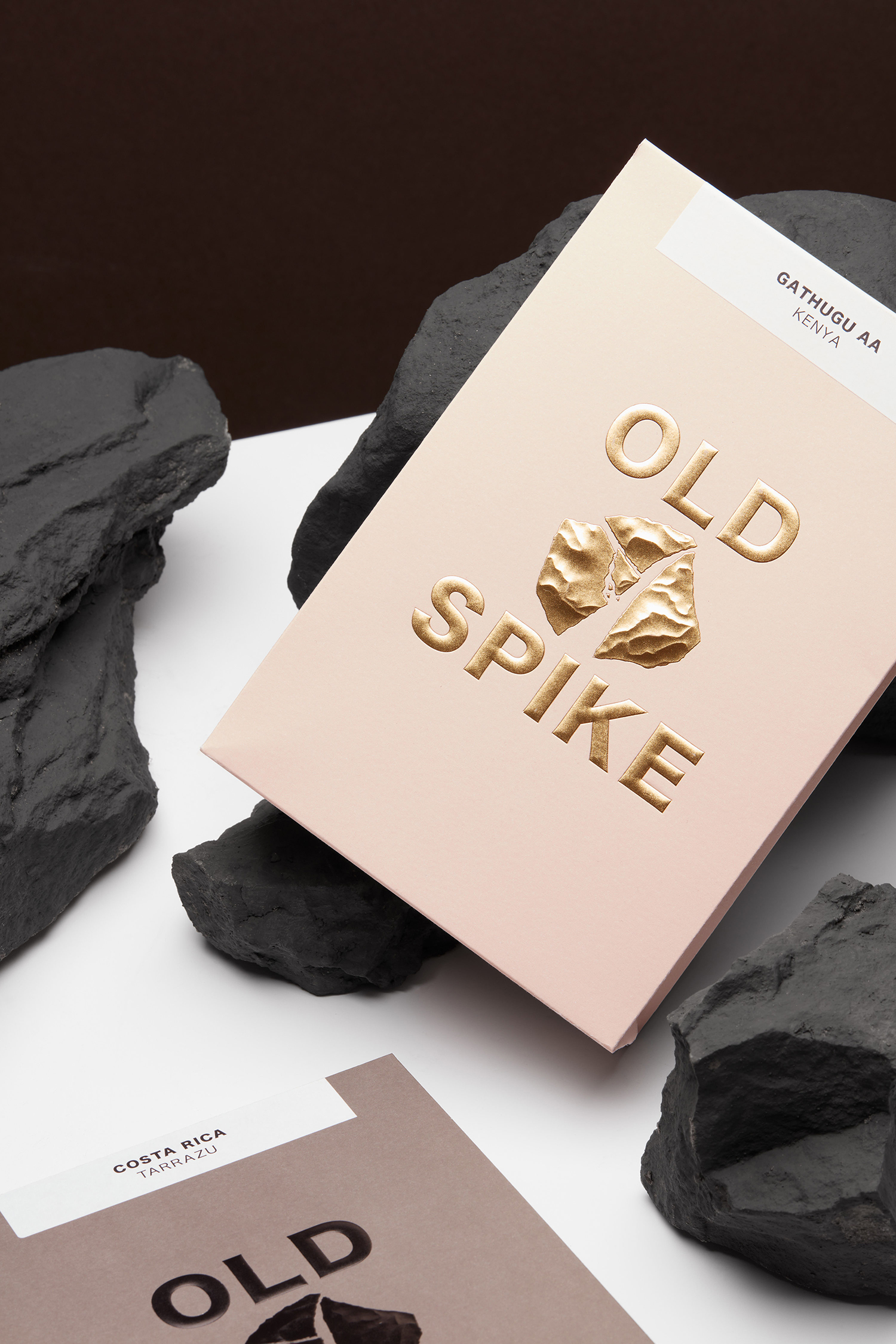 Coffee packaging design with a gold sculpted foil emboss designed by Commission Studio for London-based coffee roaster Old Spike