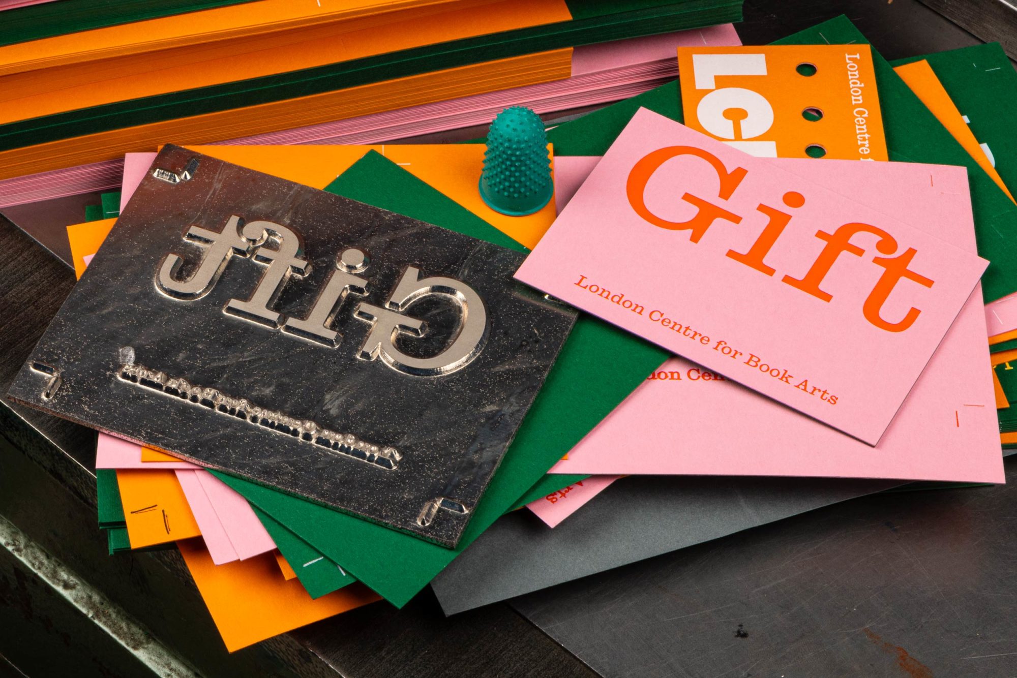 Green and pink duplex and block foiled gift card design for the London Centre for Book Arts designed by Studio Bergini