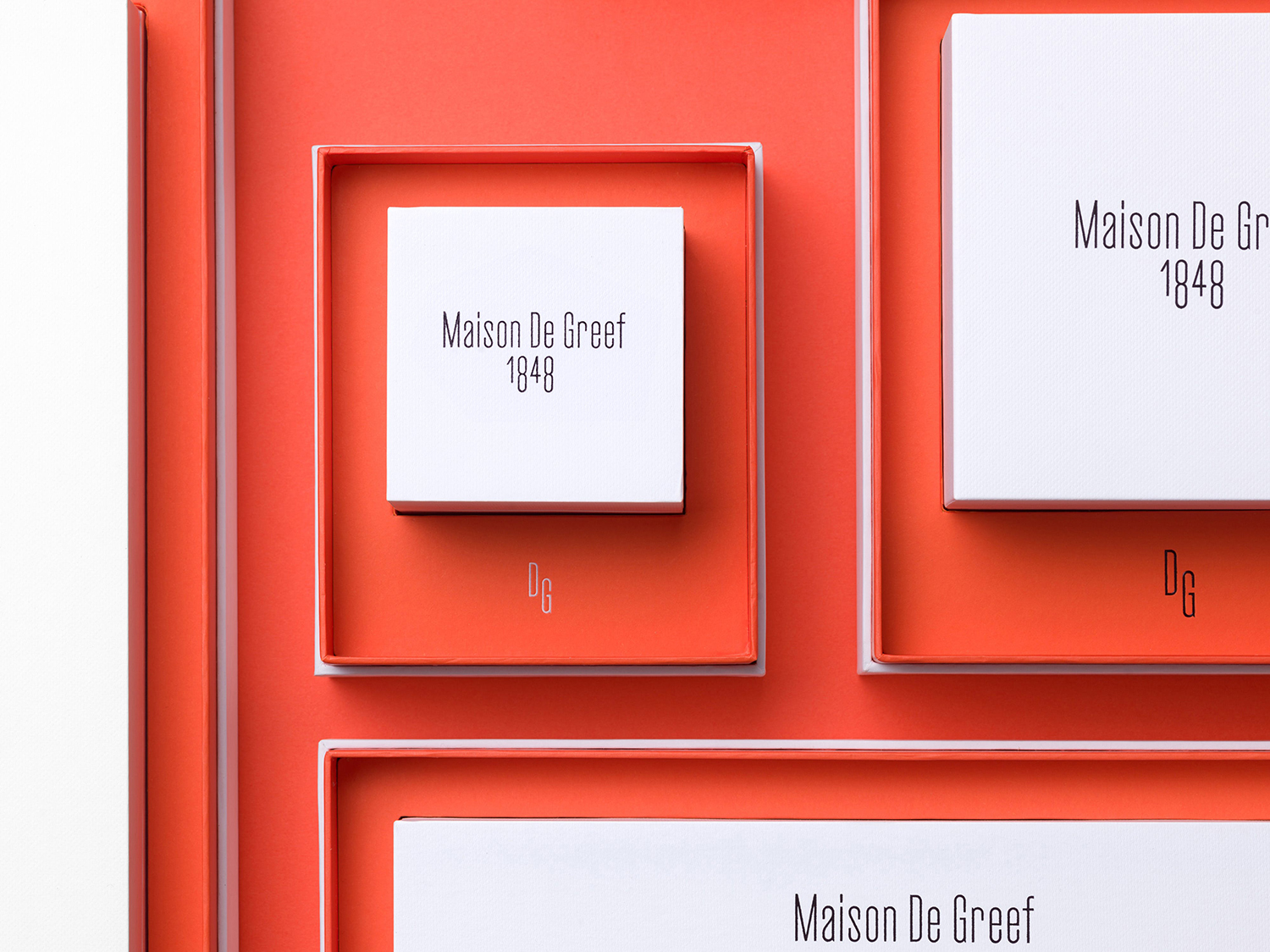 Logo and packaging by Base Design for high-end jewellery brand, expert watchmaker and retailer Maison De Greef 1848