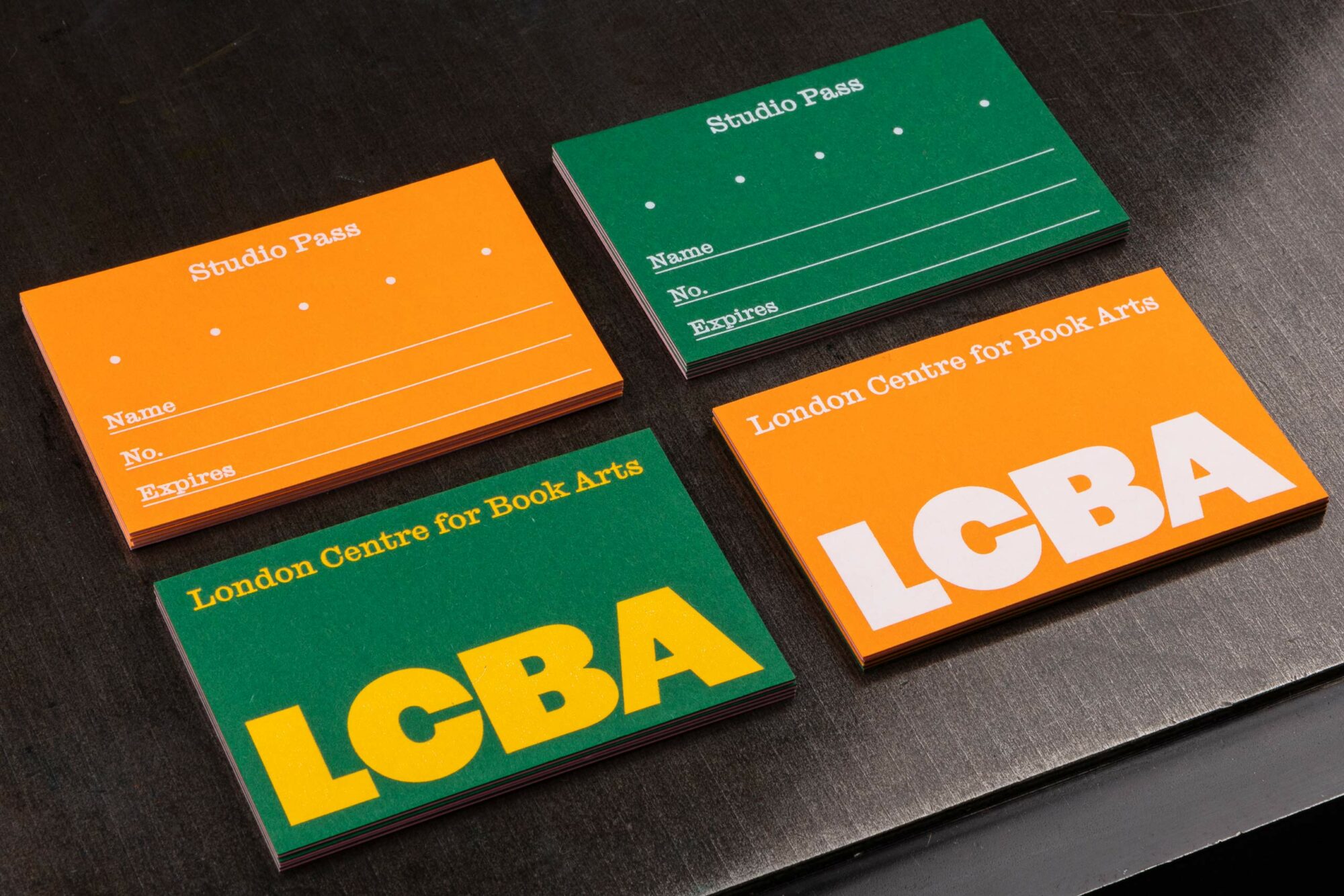 Green and orange duplex studio pass design for the London Centre for Book Arts designed by Studio Bergini