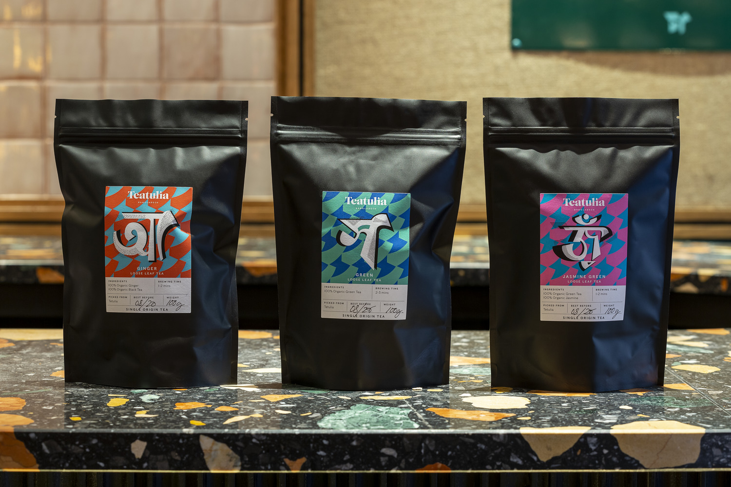 Graphic identity including logo design, print, packaging and window decals by Here Design for single origin tea brand Teatulia