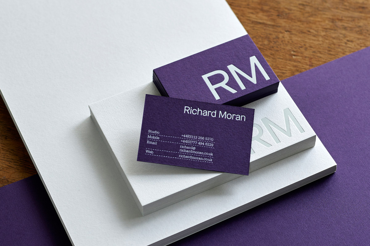 Purple card and white block foil business cards for UK based photographer Richard Moran designed by Journal