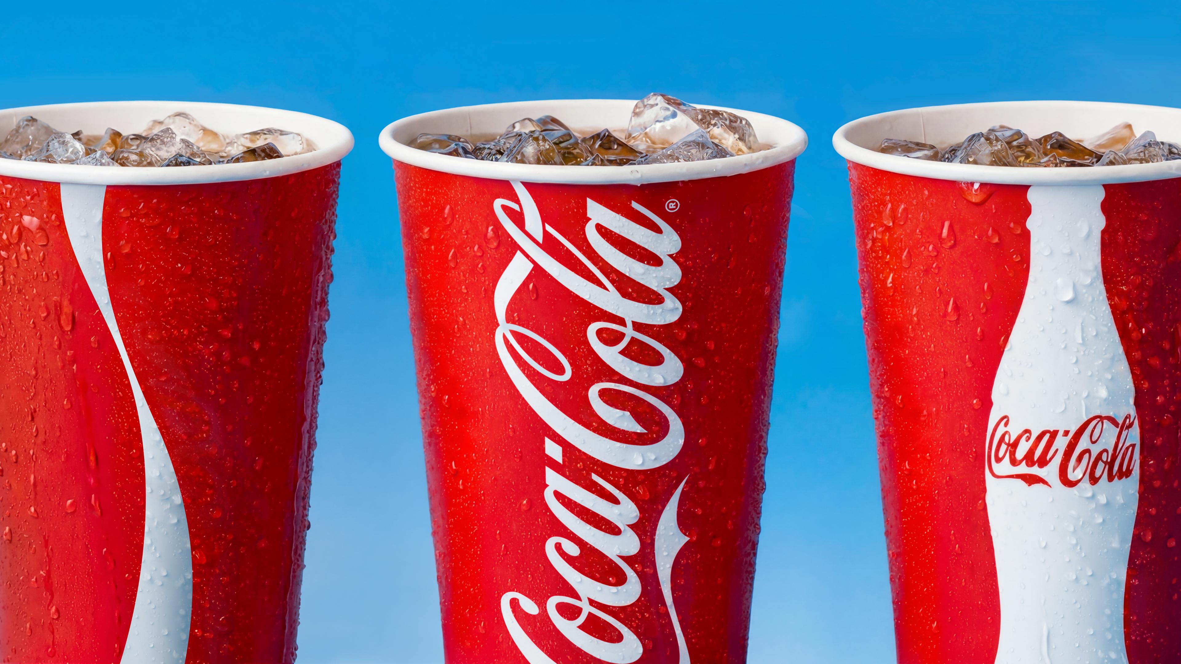 coca cola jkr rebrand logo identity design packaging bpo review cups